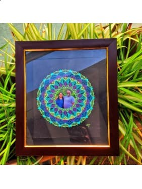 Framed mandala with a photo at its centre, from the studio